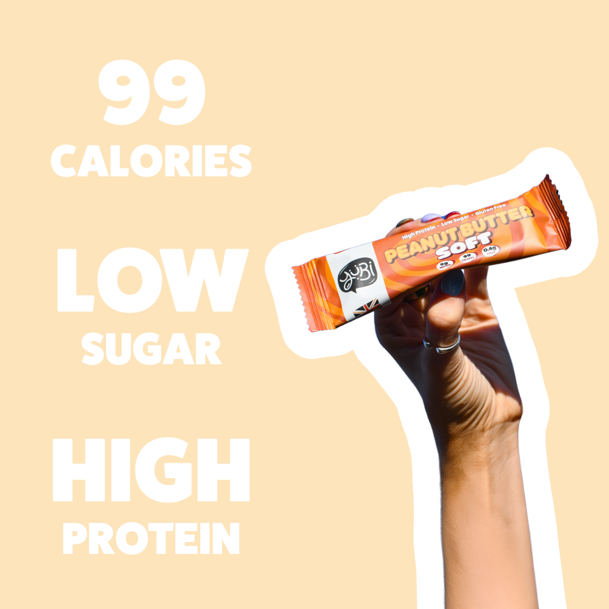 Hand holding a Peanut Butter Soft bar: 99 calories, low sugar, high protein