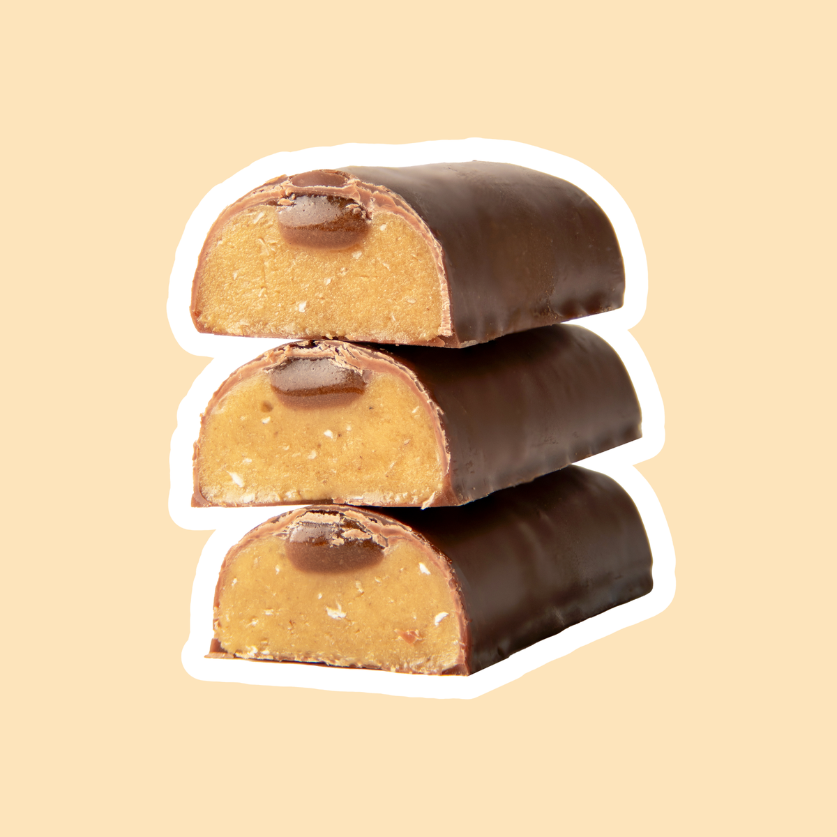 Peanut Butter Soft bars cut open showing milk chocolate coating, peanut centre and caramel