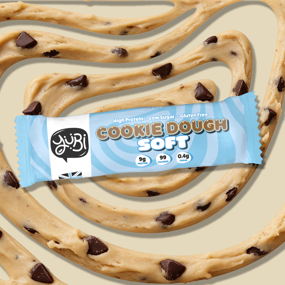 YuBi Cookie Dough Soft protein bar on a swirl of chocolate chip cookie dough