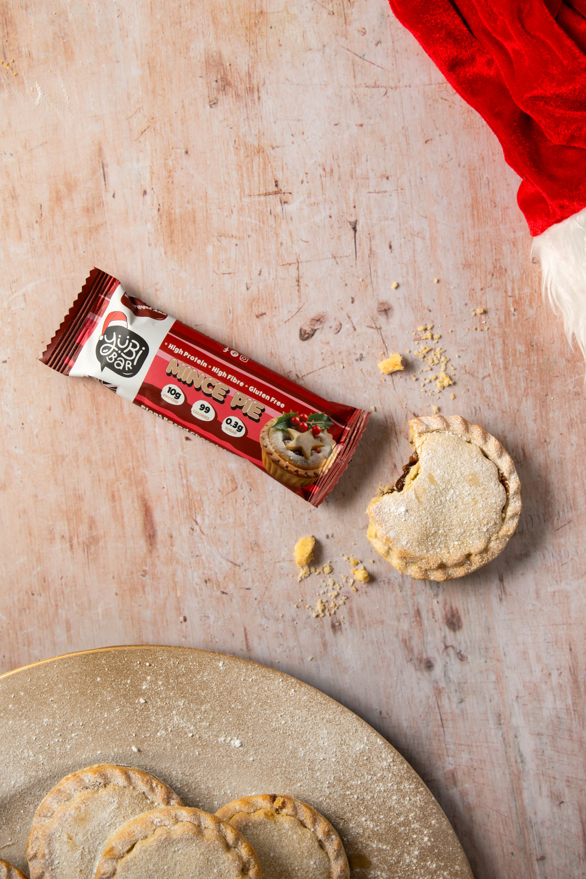 YuBi Mince Pie Christmas Protein Bars alongside mince pies
