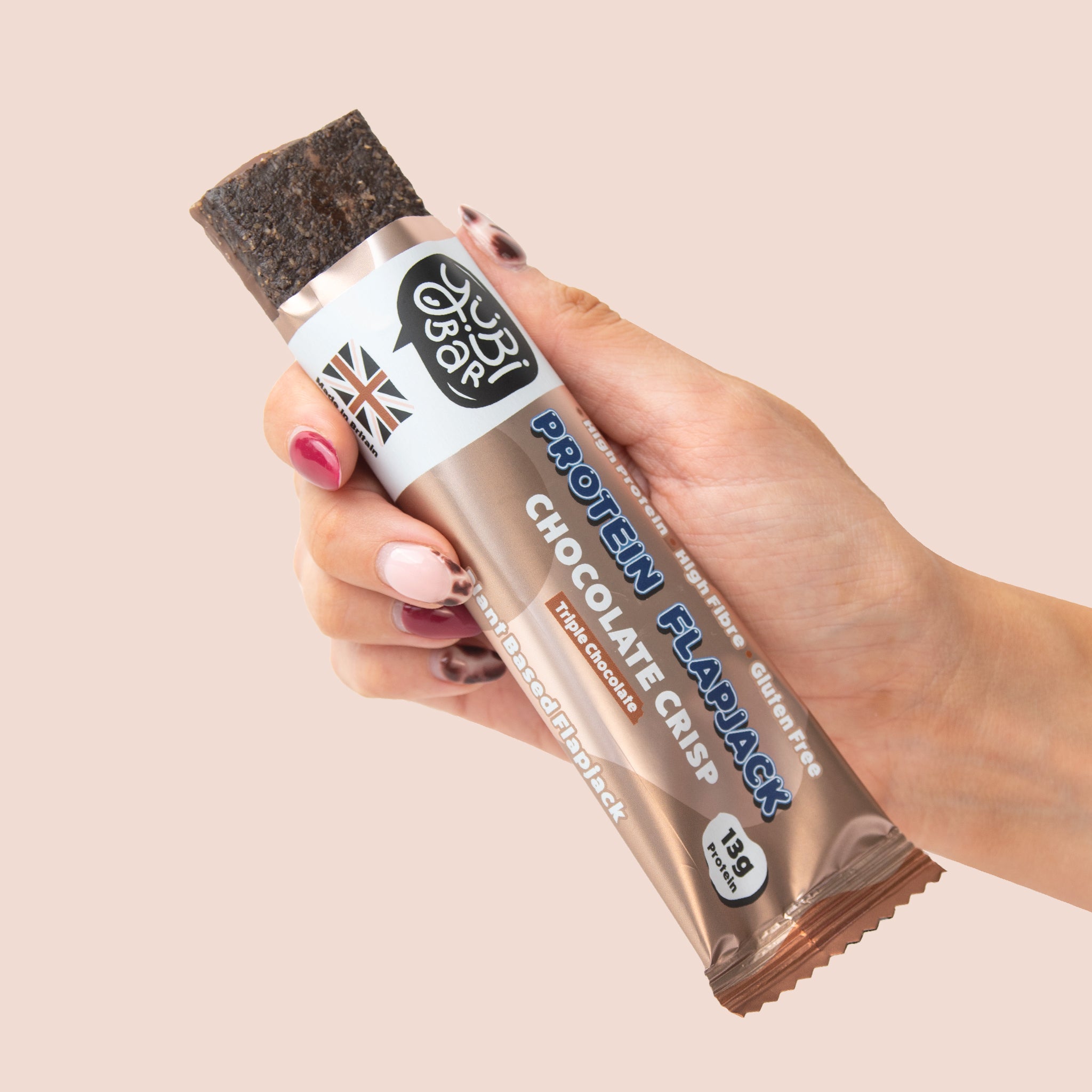 hand holding a yubibar triple chocolate low sugar high protein flapjack
