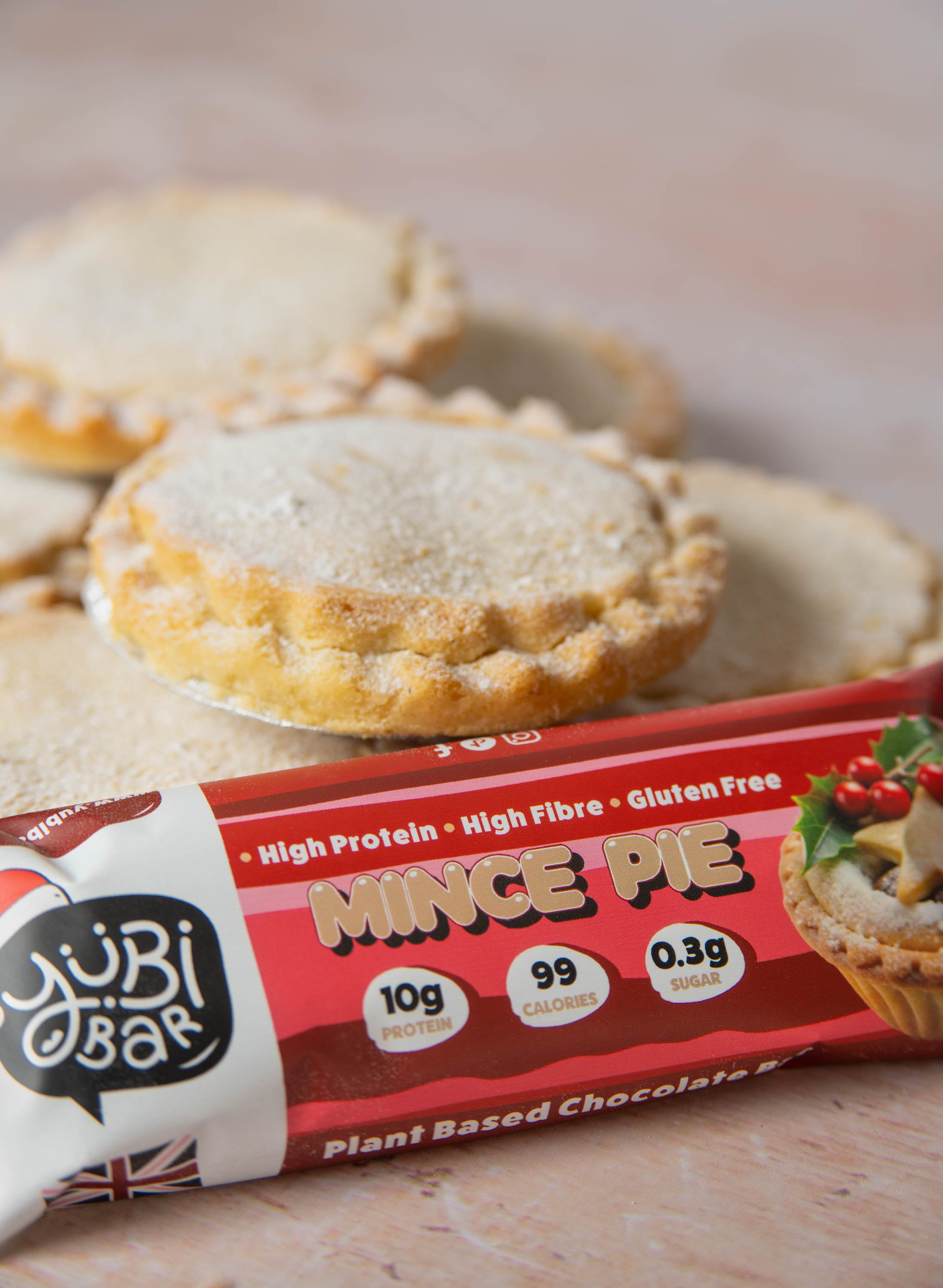 YuBi Mince Pie Christmas Protein Bar alongside mince pies