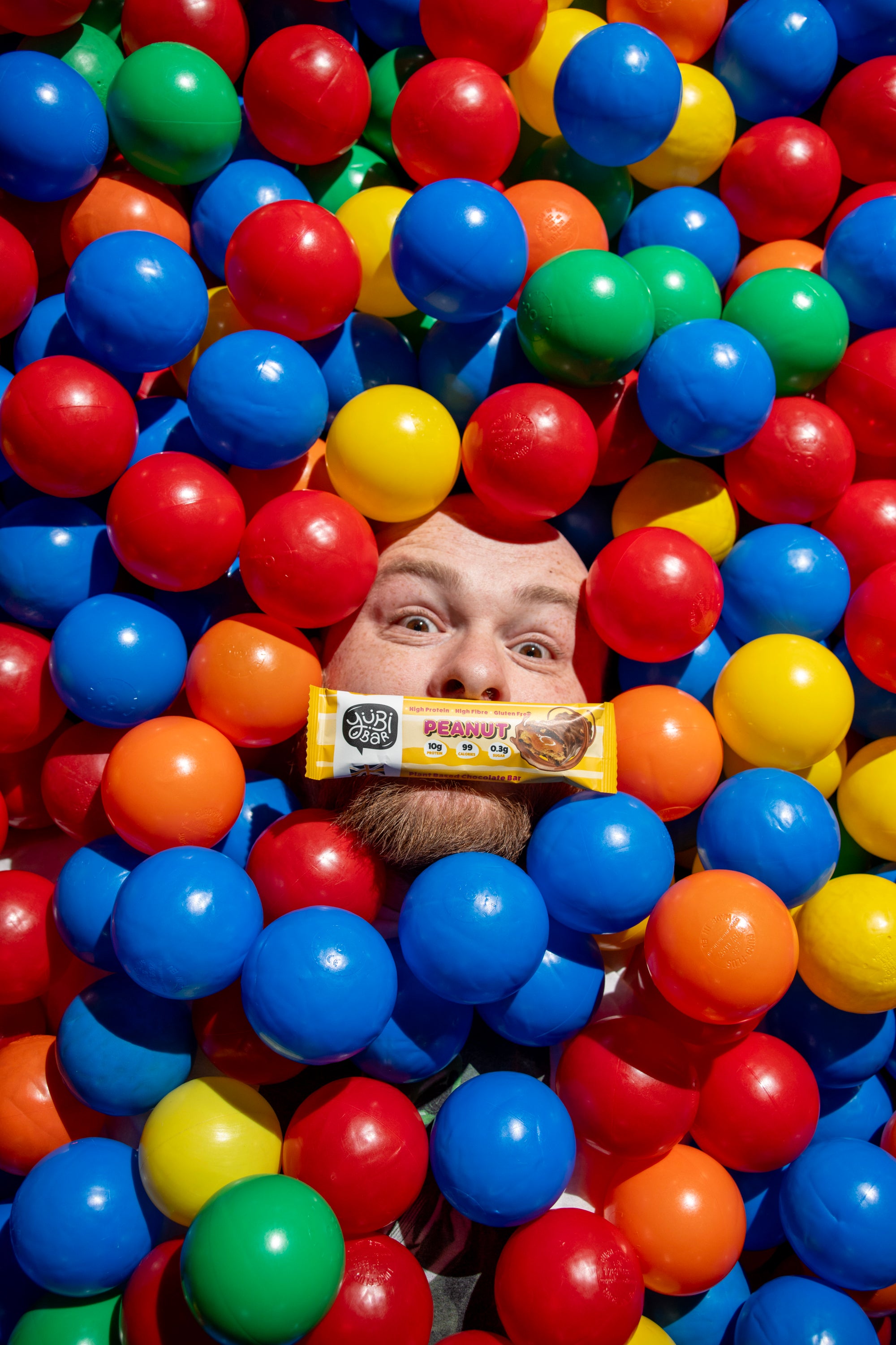 YuBi Bar low calorie high protein bar in a ball pit