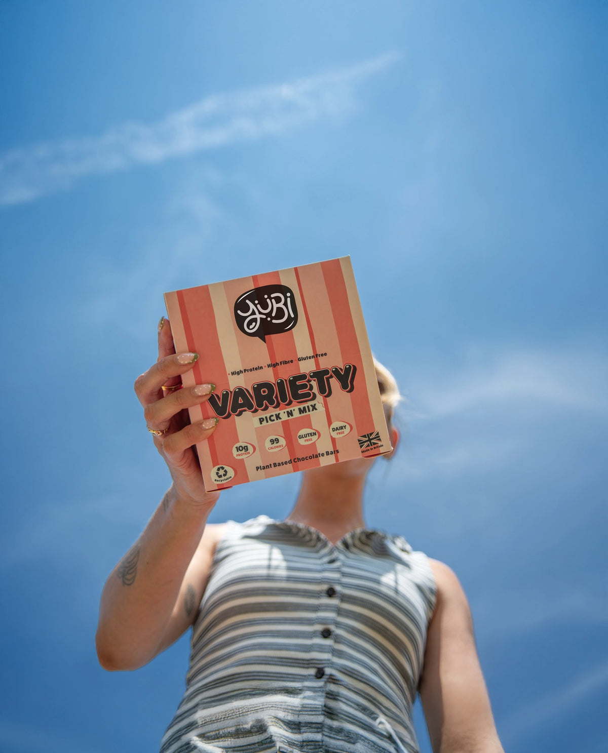 Woman holding YuBi Bar Variety Pick N Mix box