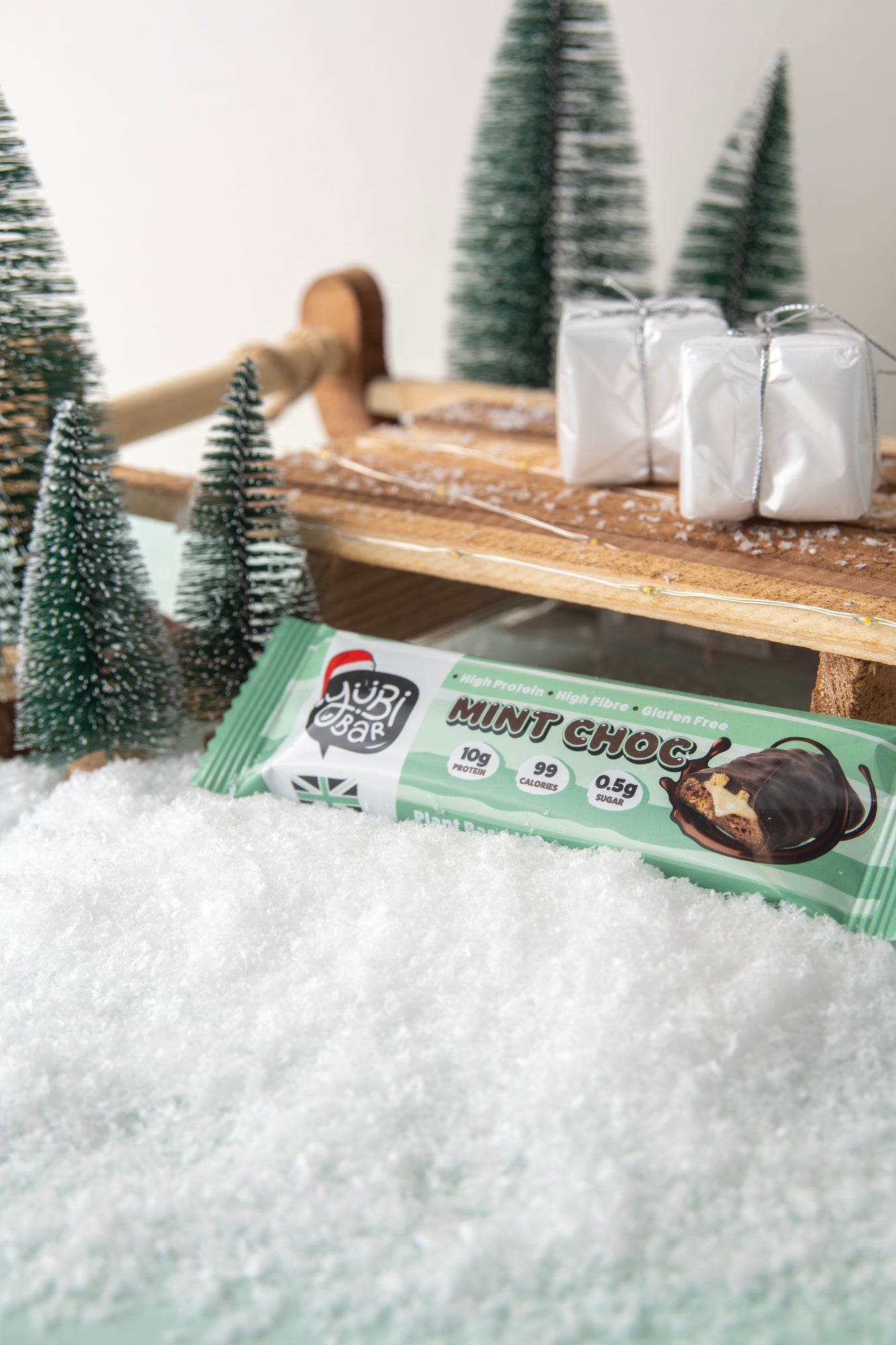 Yubibar christmas edition mint choc protein bar with sleigh in the snow