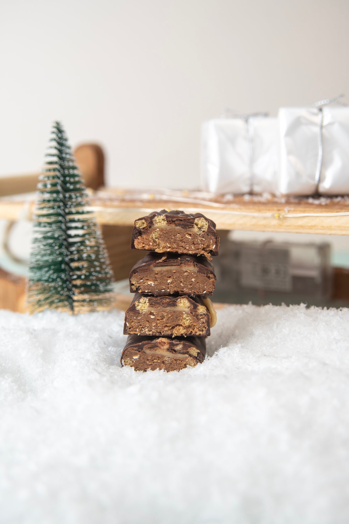 stack of Yubibar christmas edition mint choc protein bar with sleigh in the snow