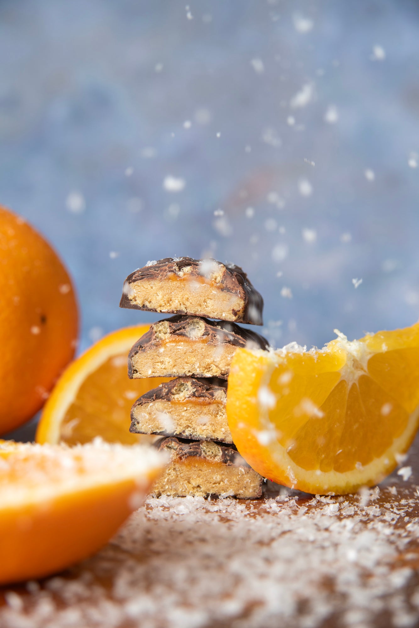 yubibar choc orange protein bar with fresh orange slices in the snow