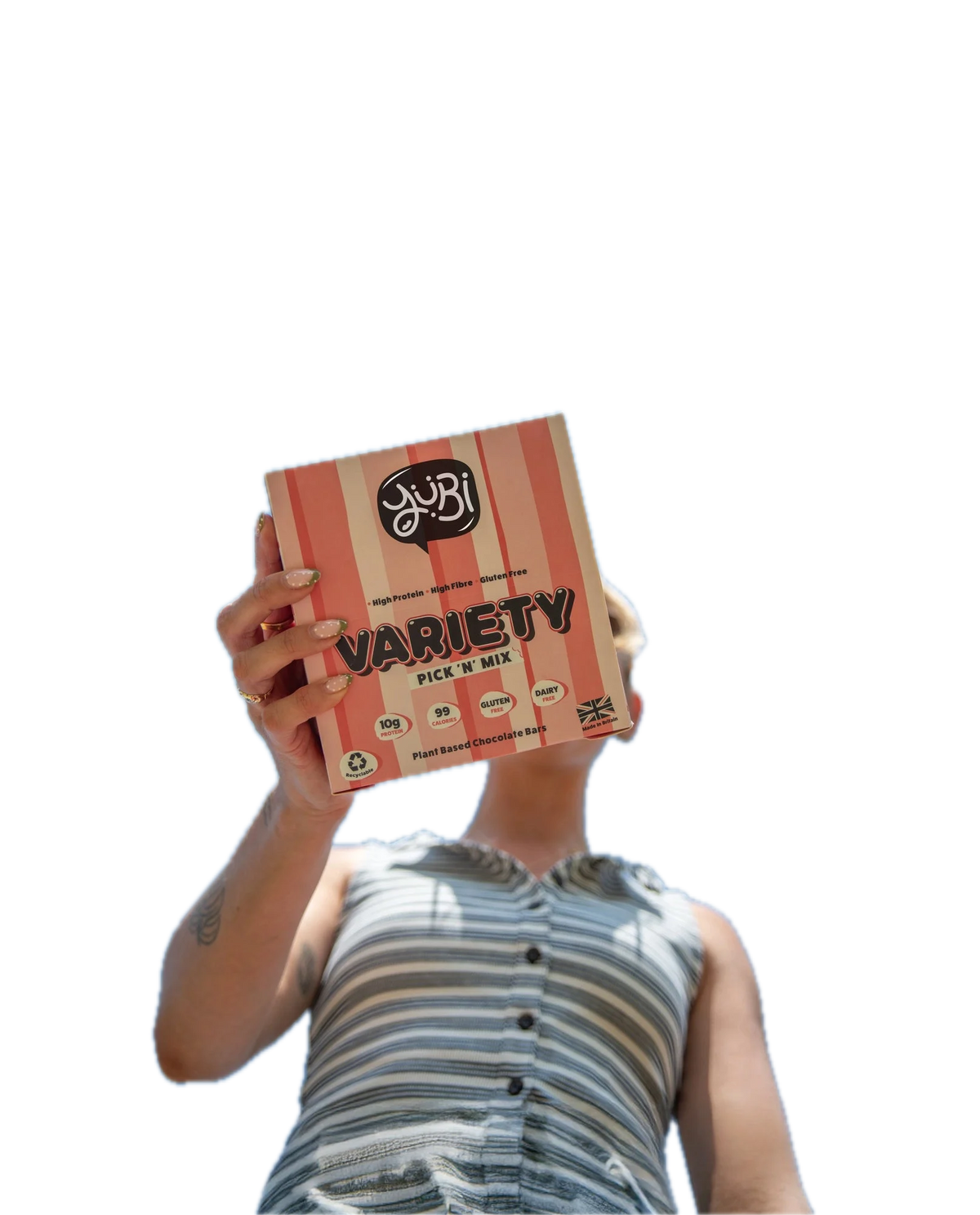 Woman holding up a YuBi Bar Variety Pick 'N' Mix box against a blue sky